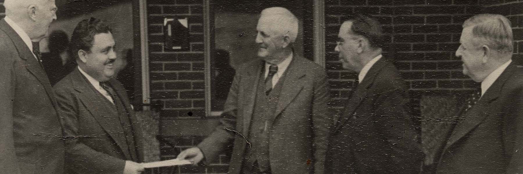 University President Herman B wells accepts the deed to Bradford Woods from John Bradford in 1937.